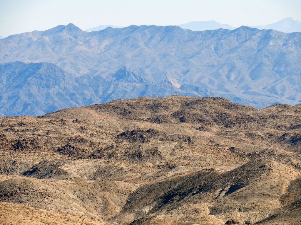 Zooming in on Mill BM, which can be seen at the high point in the middle of the picture.  In the background range, Ibex Peak (4,751 feet) is visible at the upper left: