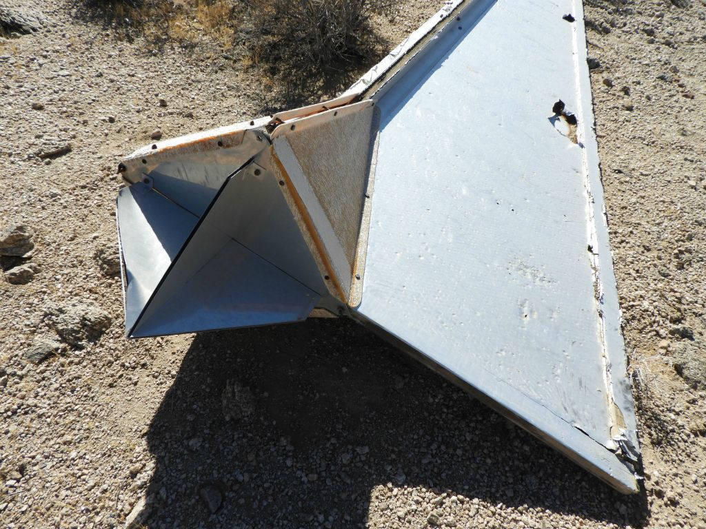 The strange looking metal piece attached to the back of the dart is likely a radar reflector: