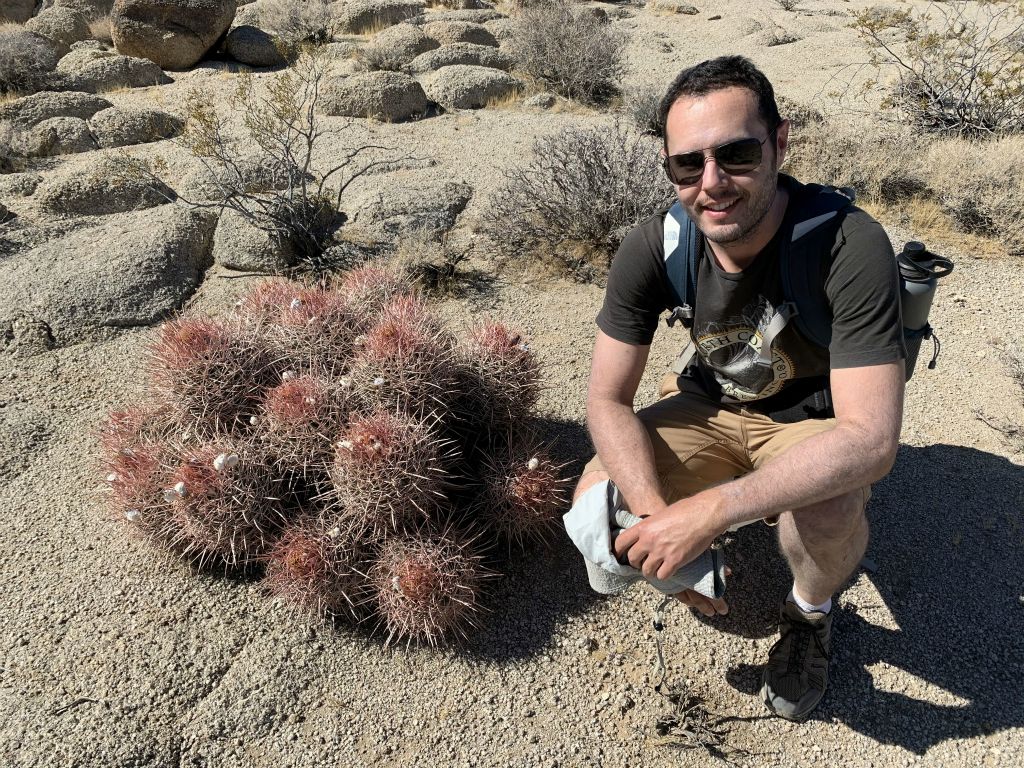 Lowell posing next to a large Cottontop cactus found along the ridge: