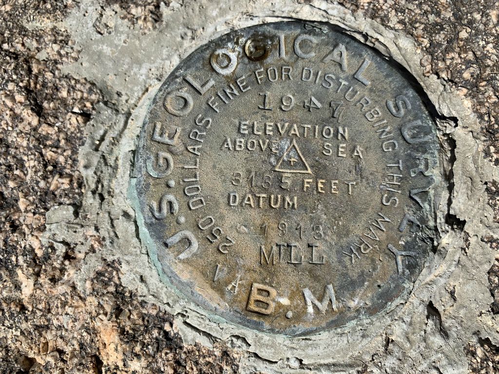 The benchmark for Mill BM was placed in 1947.  Notice that it lists the elevation as being 3,135 feet, while topo maps show it as being 3,130 feet:
