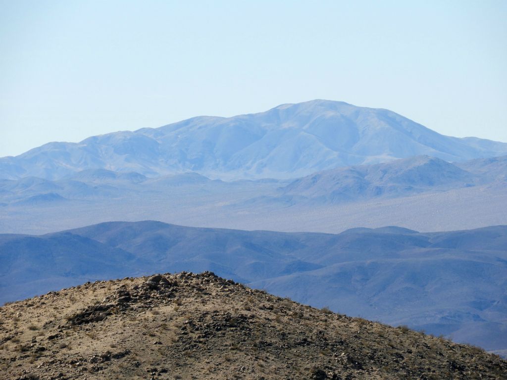 Brown Mountain (5,124 feet) is always a distinct peak that can be seen from most Owlsheads summits.  However, this peak is not accessible to hikers because it is located on military land: