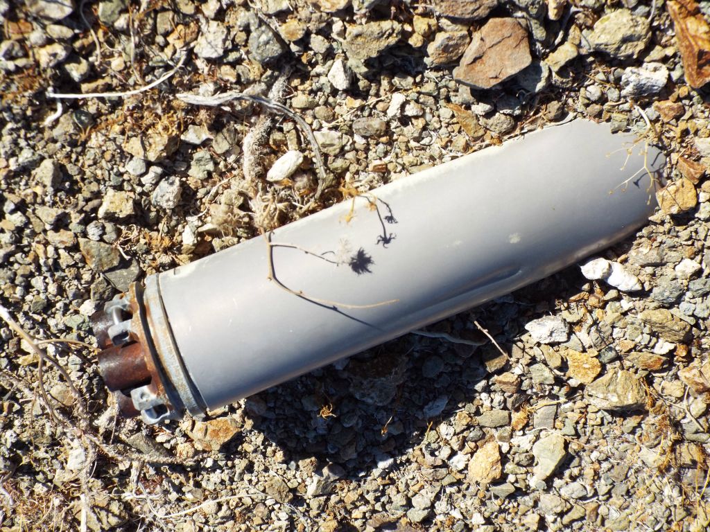 We began to find remnants of military testing and activity scattered around the area.  This shows a small rocket or missile lodged into the ground: