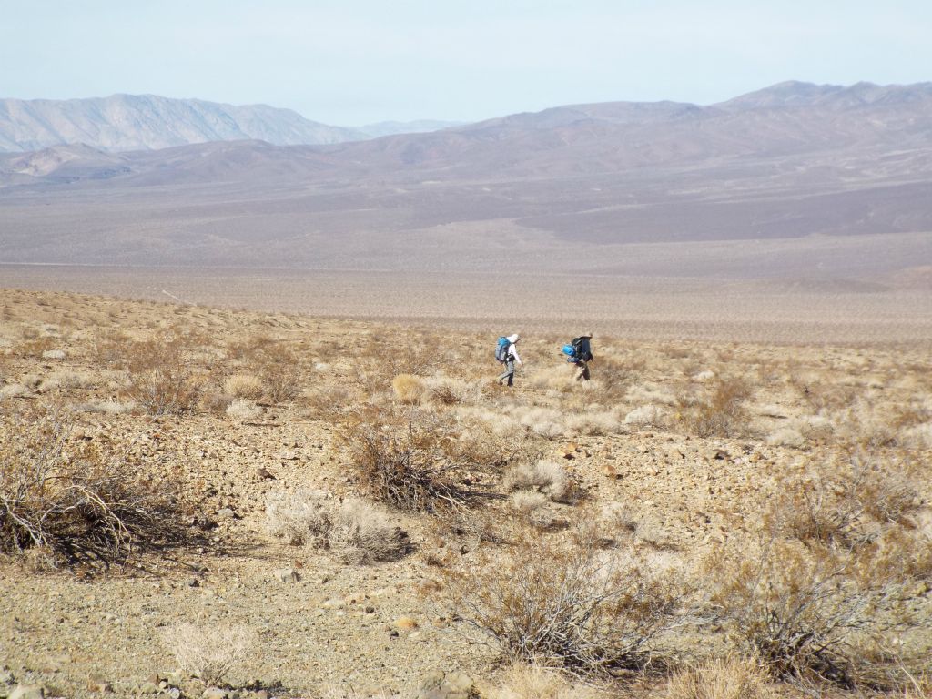 A picture of Tobin and Debbie backpacking with the southern edge of the Panamints behind them: