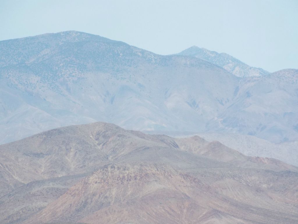 It's a bit hard to discern the ridgelines on this long range zoom, but on the left you can see Porter Peak with Mormon BM just below it.  On the right, that's Telescope Peak: