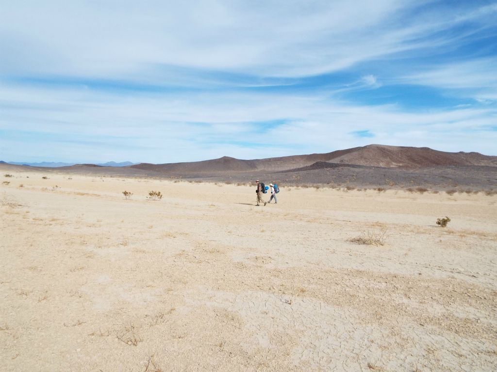 Backpacking across Wingate Dry Lake toward the northern end:
