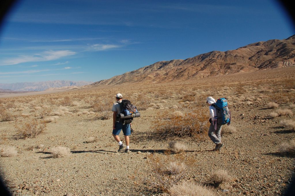 Steve and Debbie backpacking with the northwestern tip of the Owlsheads in the background: