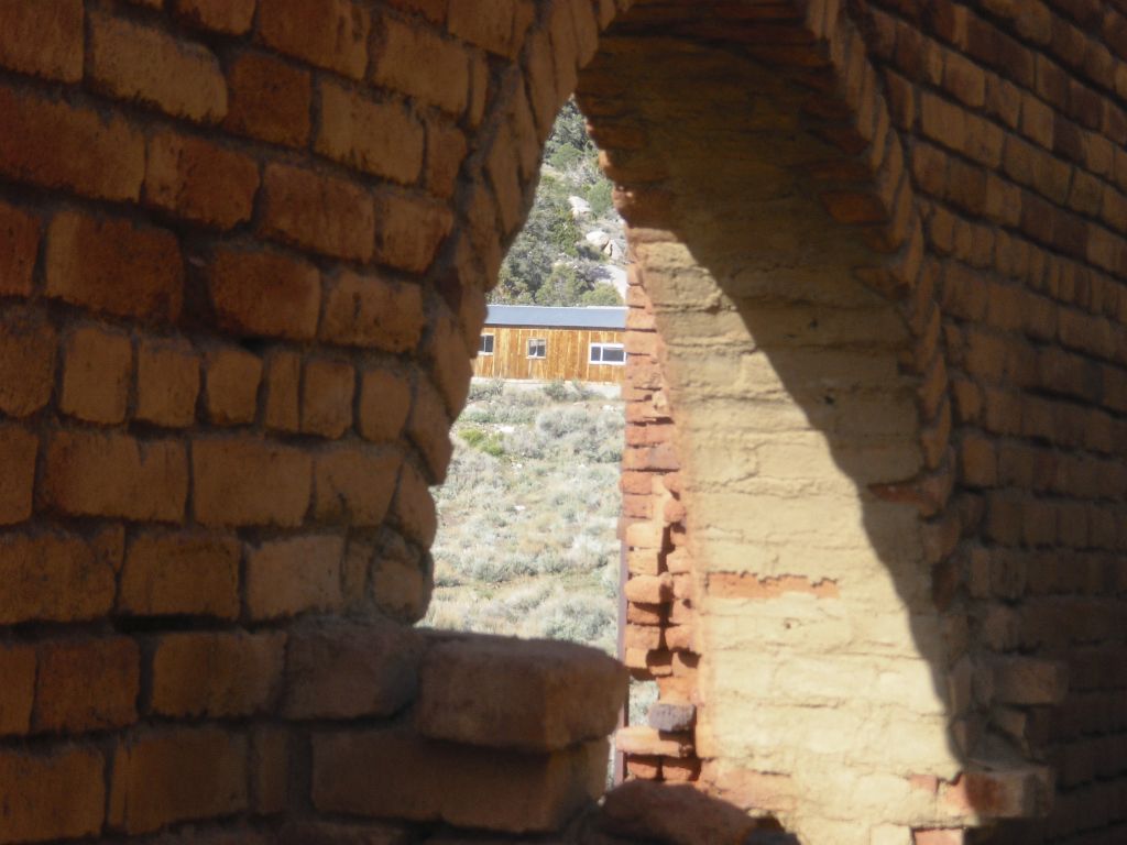 View of the Panamint Hilton through the brick archway: