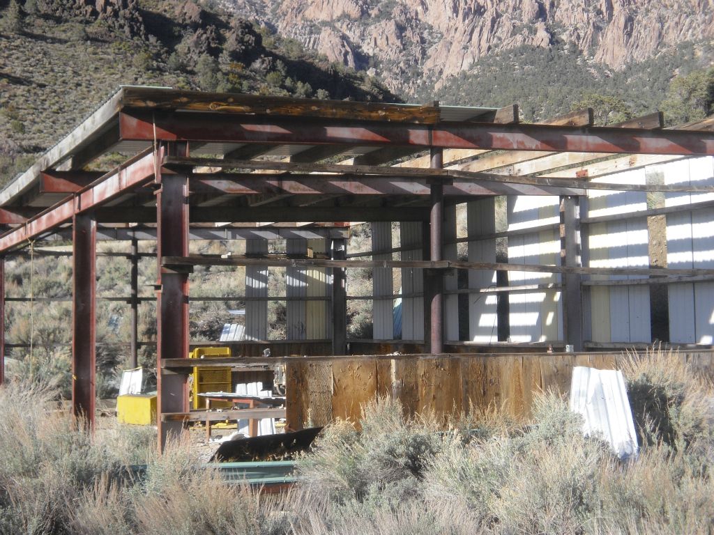 This building still has some roof coverings and siding on parts of it: