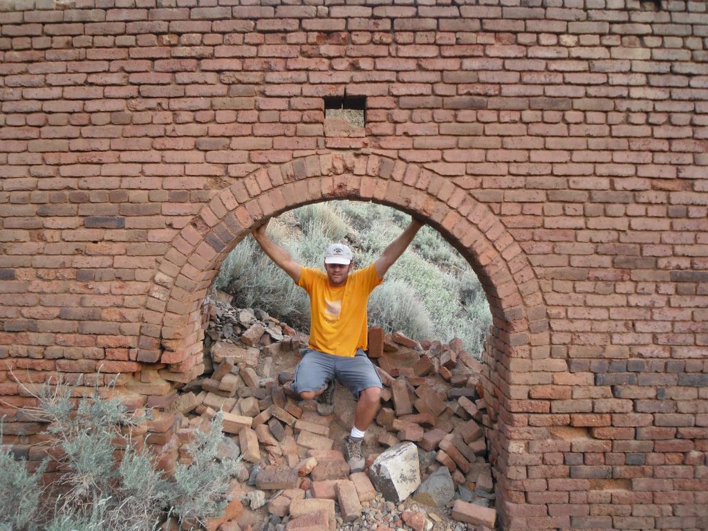 A picture of Steve from 2009 pictured underneath the brick archway: