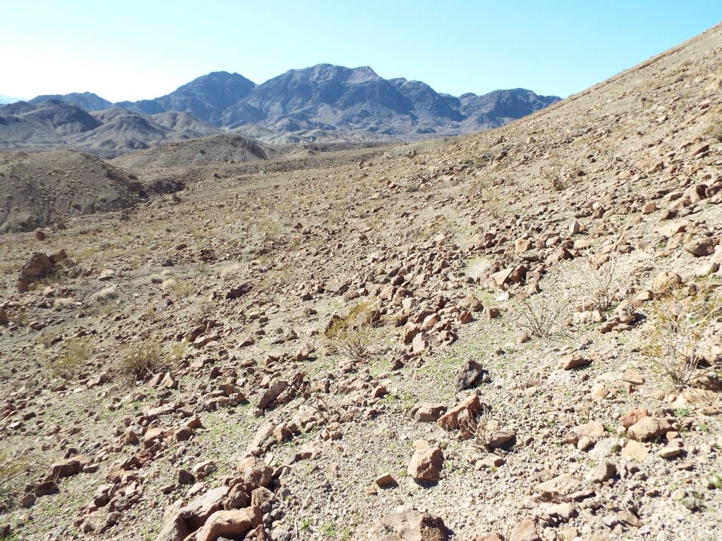 We had to wrap around a hillside to the southwest to stay on the Front Face Route.  Sugarloaf Peak was not yet visible: