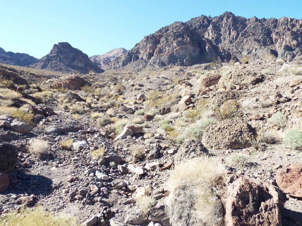 As we approached the front face of the mountain up ahead, we continued working toward the gorge entrance to the right of the small triangular peak: