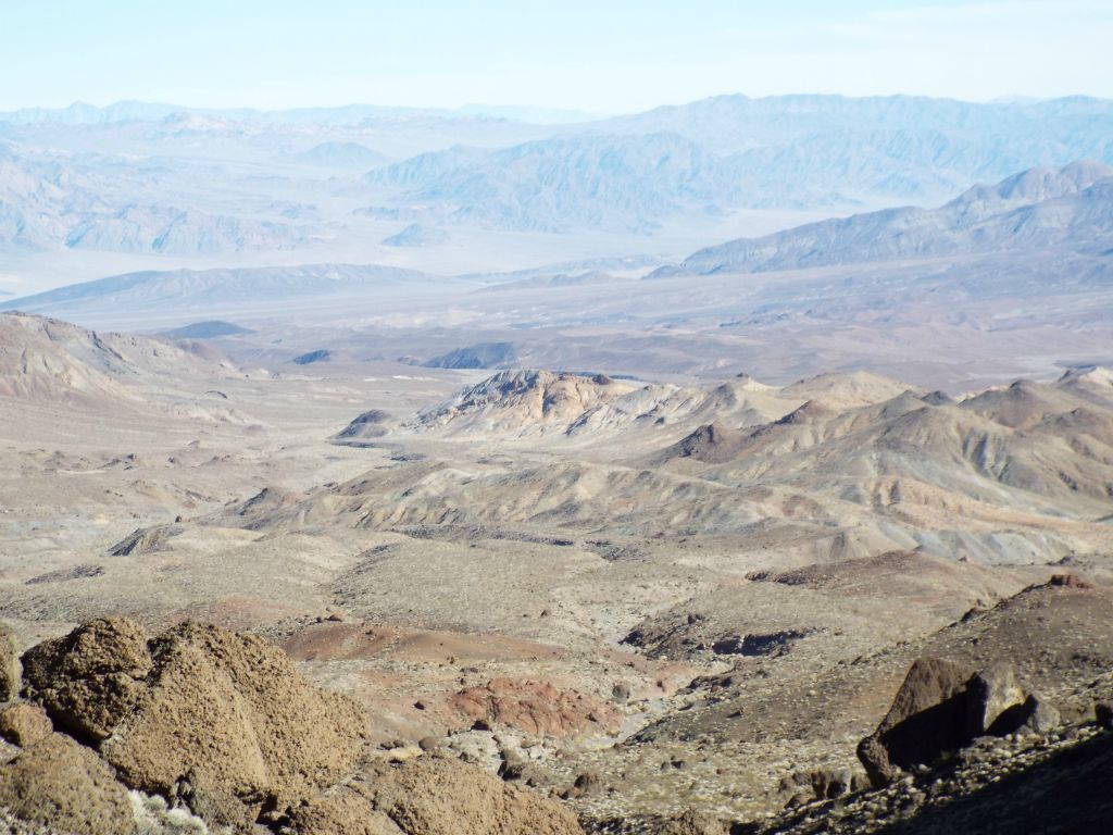 Zooming in, the colorful hills east of Sugarloaf Peak can be seen in the foreground.  At the middle left side, you can see Shoreline Butte: