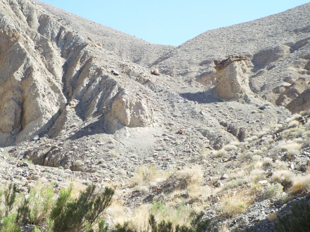 Another rock-topped pillar standing above the canyon: