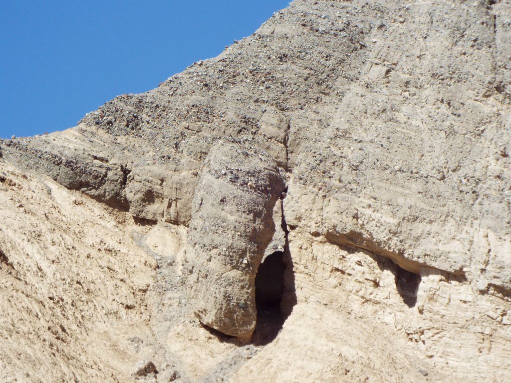 Outside of TB Slot 1, we took note of this large leaning boulder on the hillside: