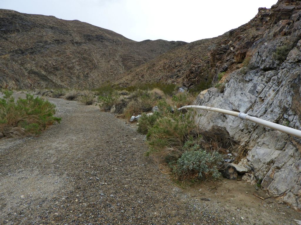 On the right side, you can see a section of the continuous water pipe which carries water from the creek to Panamint Springs: