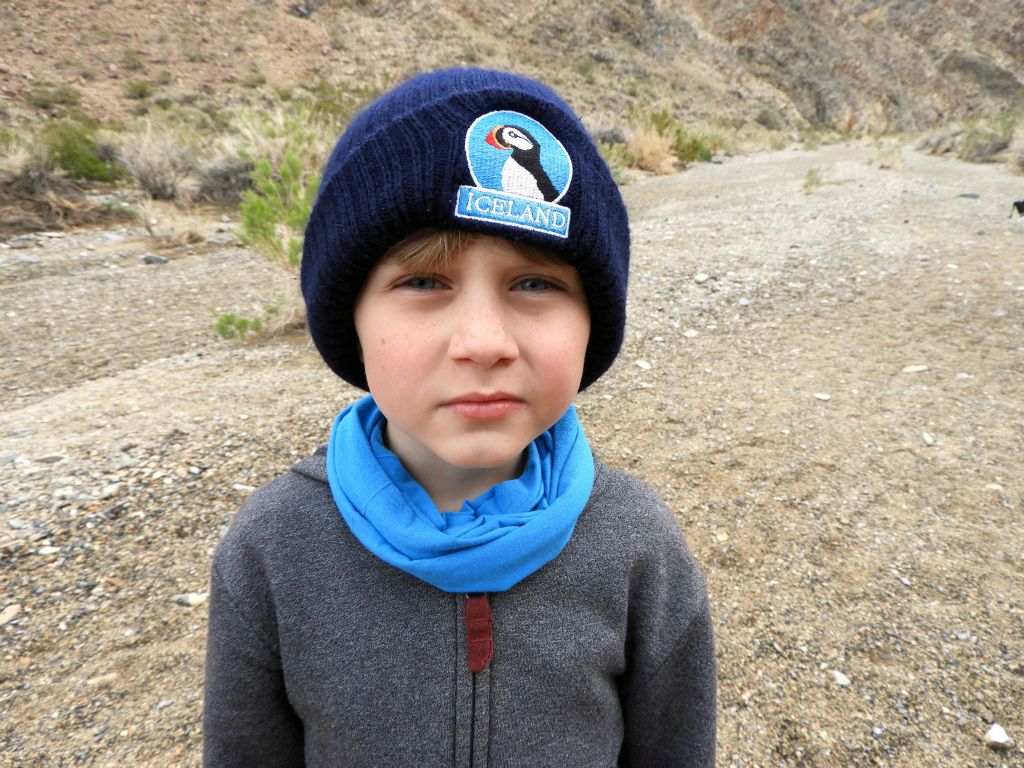 Stefan trying to keep warm as the hike started out cold and rainy: