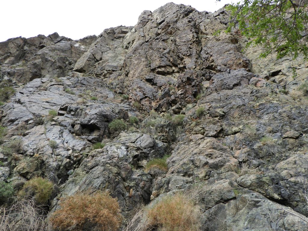 Looking straight up a towering canyon wall.  It would probably be a good idea to watch out for falling rocks in this area: