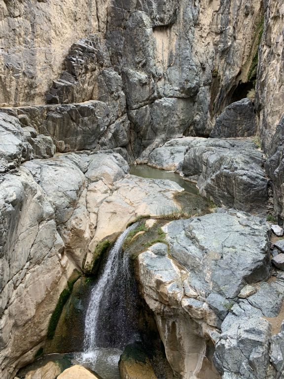 This extremely hard to reach section of slot canyon contains several small waterfalls such as the one pictured here: