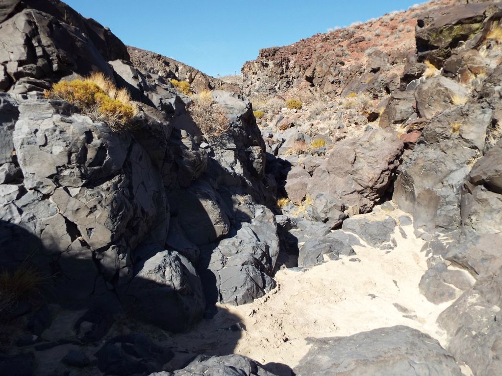 With the wash literally filled with boulders large and small at times, it made the hiking very slow going.  This is what caused us to eventually arrive at the main side canyon so late in the day: