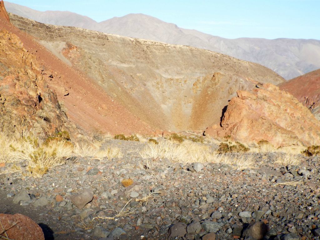This circular bowl area on the left side canyon wall appears to be a naturally-formed catch basin: