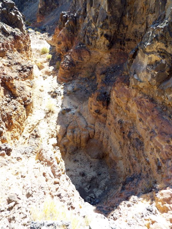 Full overview of the plunge pool, down climb area (washed out by the sun), and continuation of the canyon just beyond: