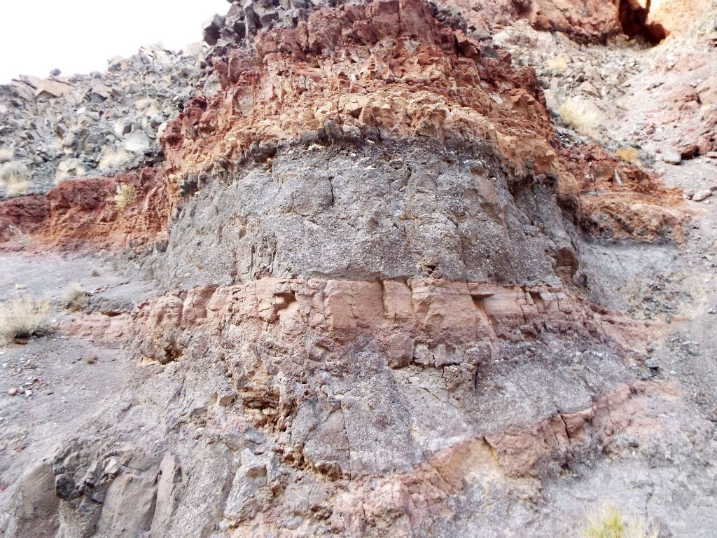 A bulge in the canyon wall retains the pretty rock layers as it stretches out: