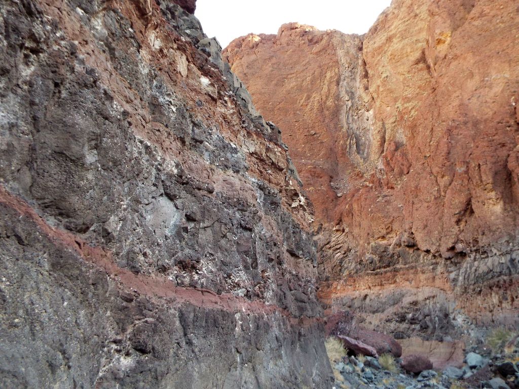 This picture captures contrasting walls on both sides of the canyon with the dry fall high above: