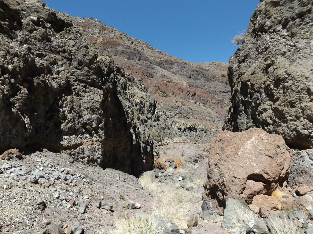 Looking back at the narrow passage I had passed through with colorful hillsides in the background: