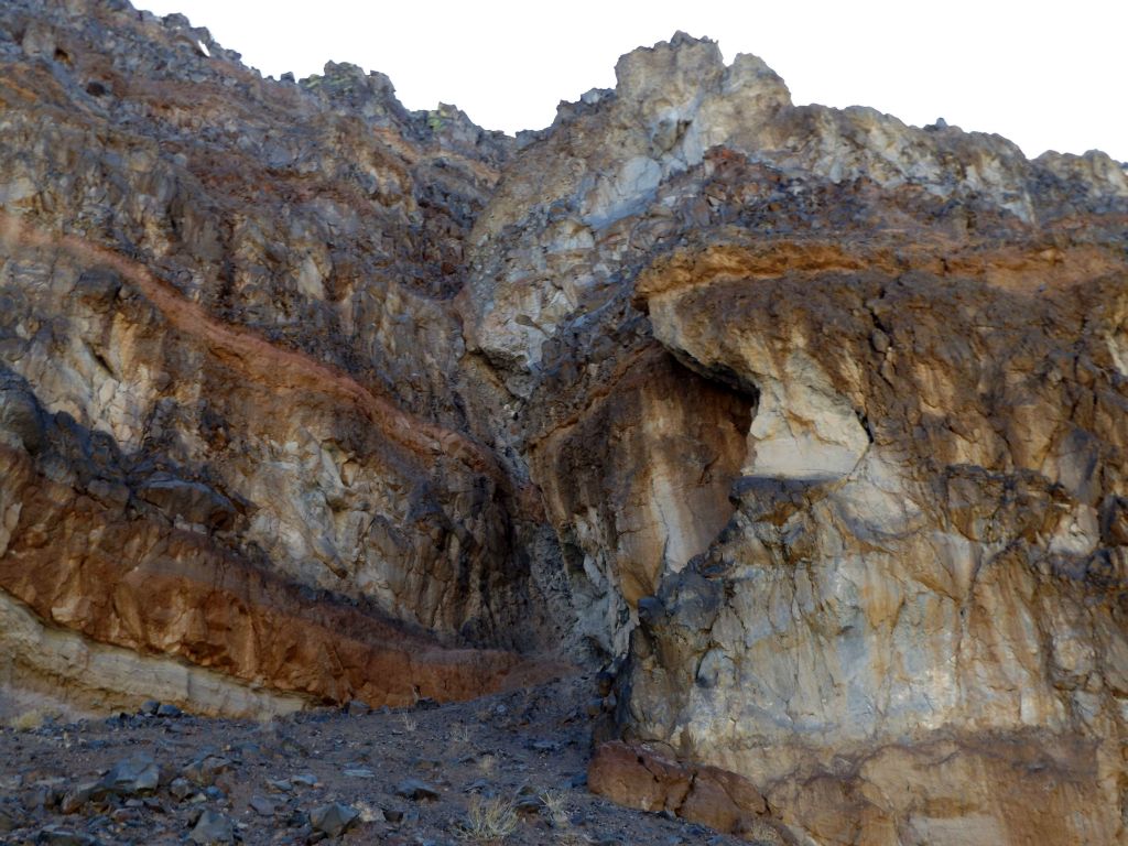 The cliff face extended over to the right, where it curved and had a section that was broken off:
