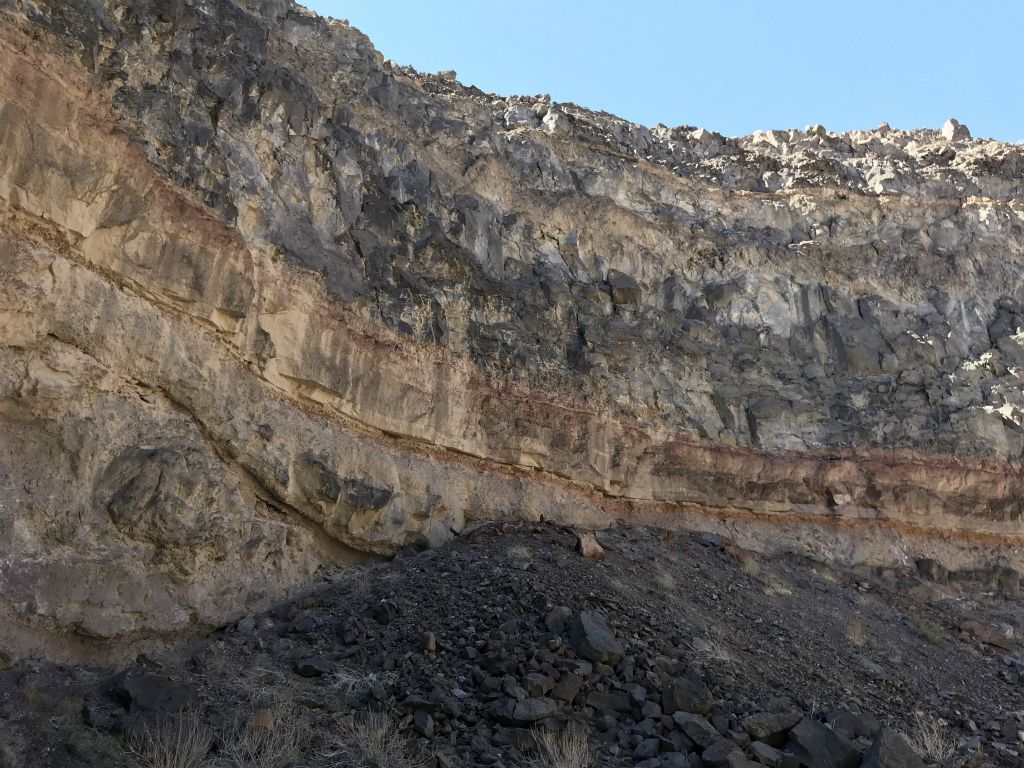 The walls all around towered above and featured sheer vertical cliffs: