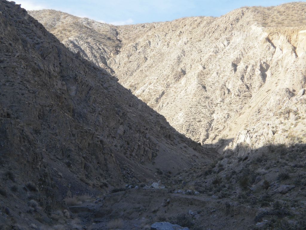 Looking back at the high framed walls of the lower canyon: