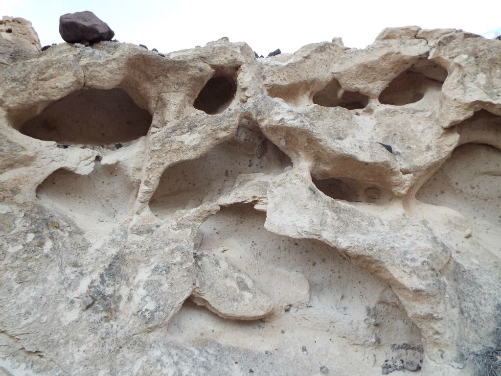 Two examples of dramatic cavernous weathering within the canyon walls: