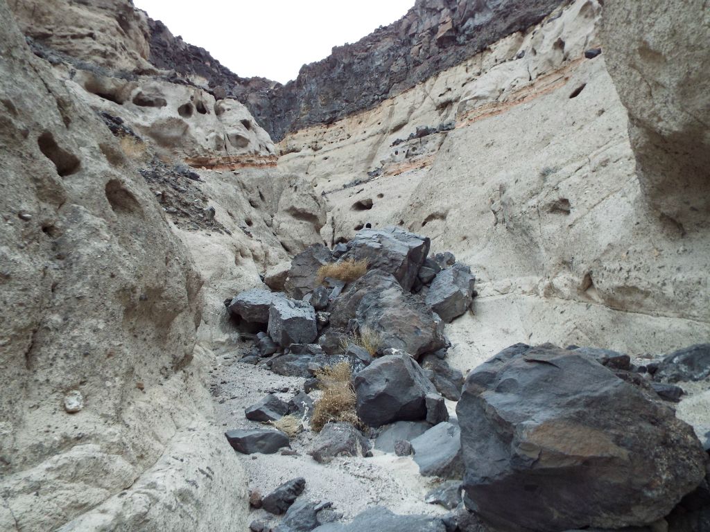 This was his view.  At this point, the canyon walls were extremely high, the narrows tight and deep, and the wash covered with large and small boulders: