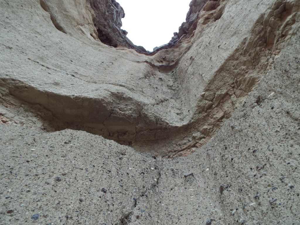 Looking up the major dry fall, you can see the polished rocks which are a part of the dry fall's composition: