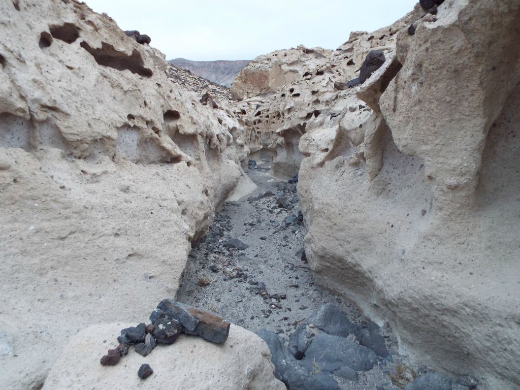 The placement of the small rocks on the boulder in the foreground was either caused by flash floods or rockfall from above: