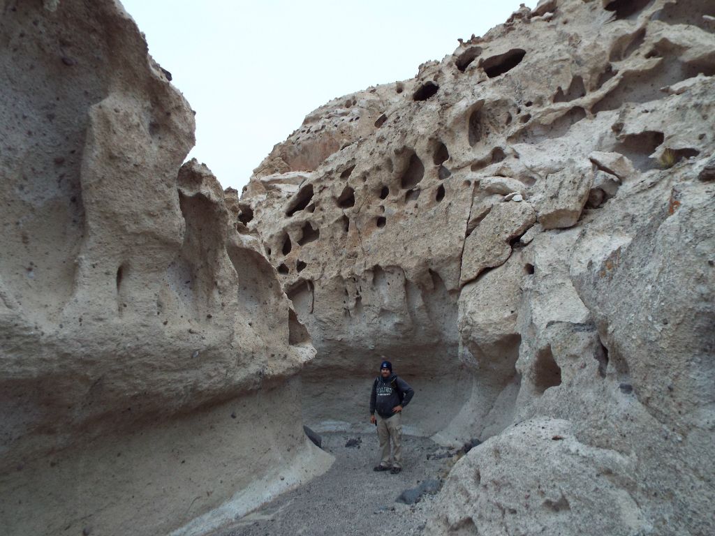 Getting a picture next to one of the very unusual tafoni canyon walls: