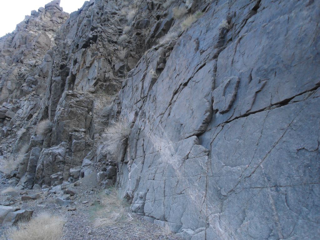 A smooth polished wall along one side of the canyon: