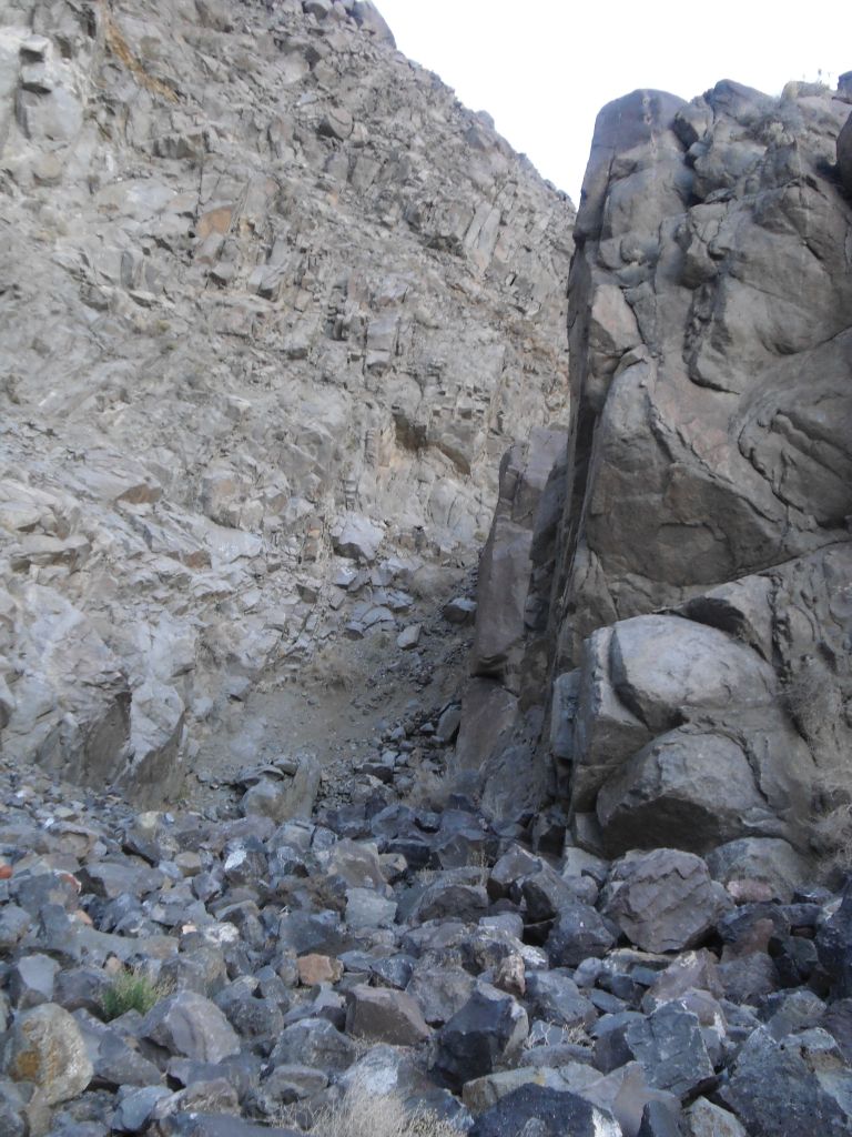 A towering block of rock on the right side of the canyon: