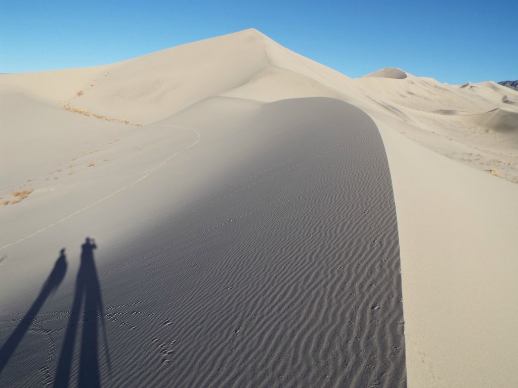 Continuing along the obvious route toward our first goal with long shadows created by early morning sunlight: