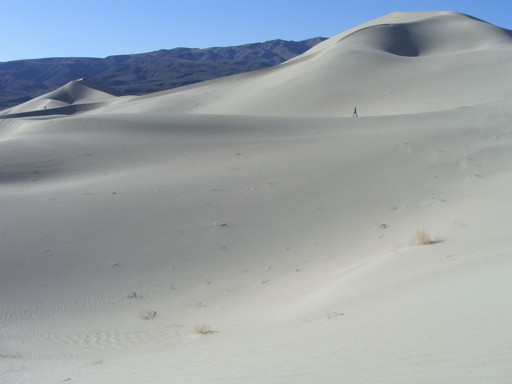 A member of our group walking out towards a personal peak they have chosen to summit: