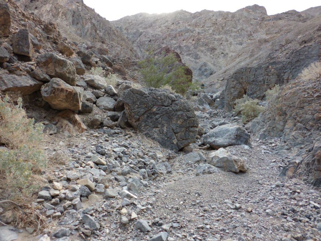 The wash remained narrow with occasional boulders to work around: