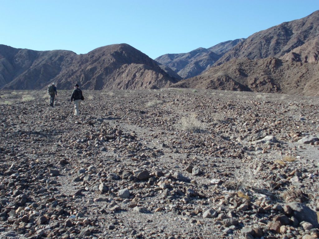 Our hikers heading up a rugged fan: