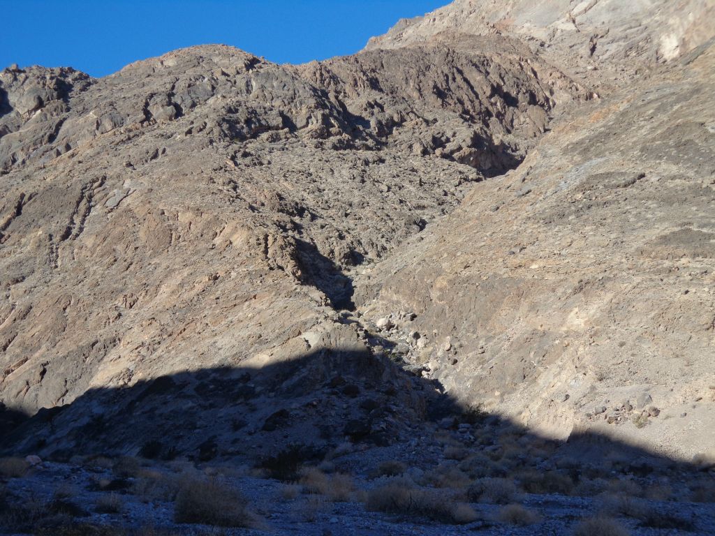 Immediately we noticed this gully heading up to the right.  This is the bypass of the Forbidden Canyon 1st major dry fall.  The bypass is a matter of trial and error as it requires heading a ways up the gully and then testing different routes to safely reach the ridge to the left:
