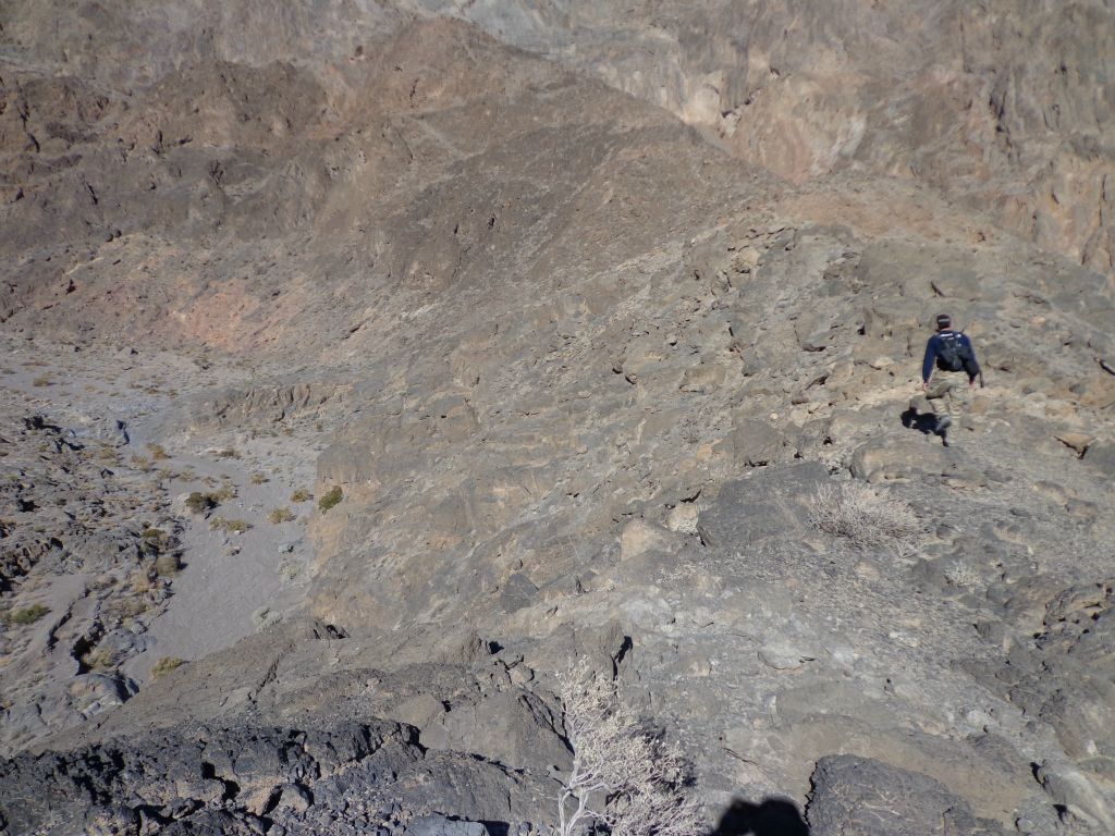 Tobin walking along the top of the ridge looking for an easy way to drop into the canyon.  We eventually found one: