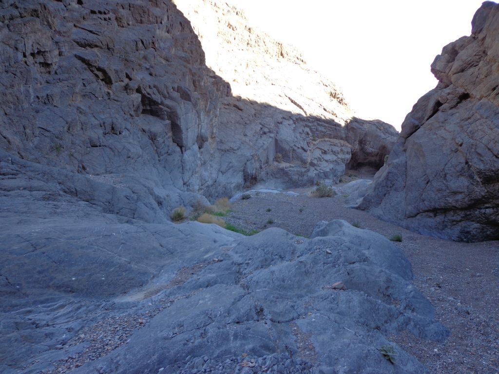 Blue colored rock reaching down into the canyon: