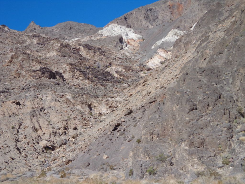 Patches of white up on the right hillside: