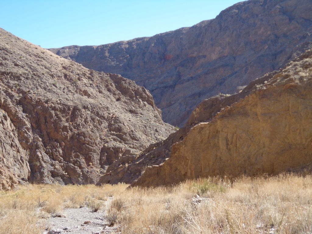 Looking back, the 1,000 foot high cliffs continued to dominate the landscape: