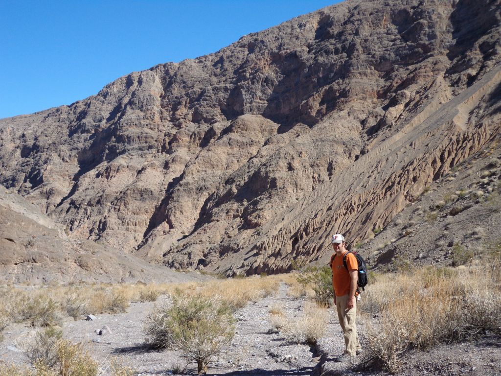 Steve getting a picture in front of the 1,000 foot cliffs on the way back: