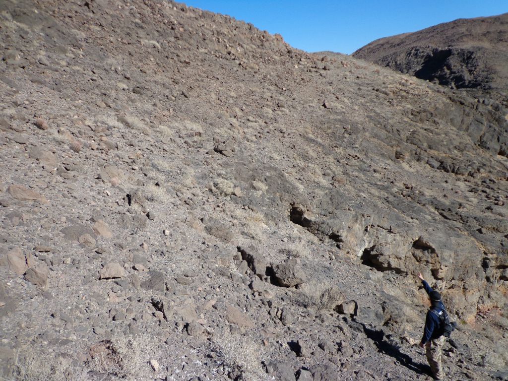 Tobin pointing up at the bypass route which is easy to follow to get back on the ridge: