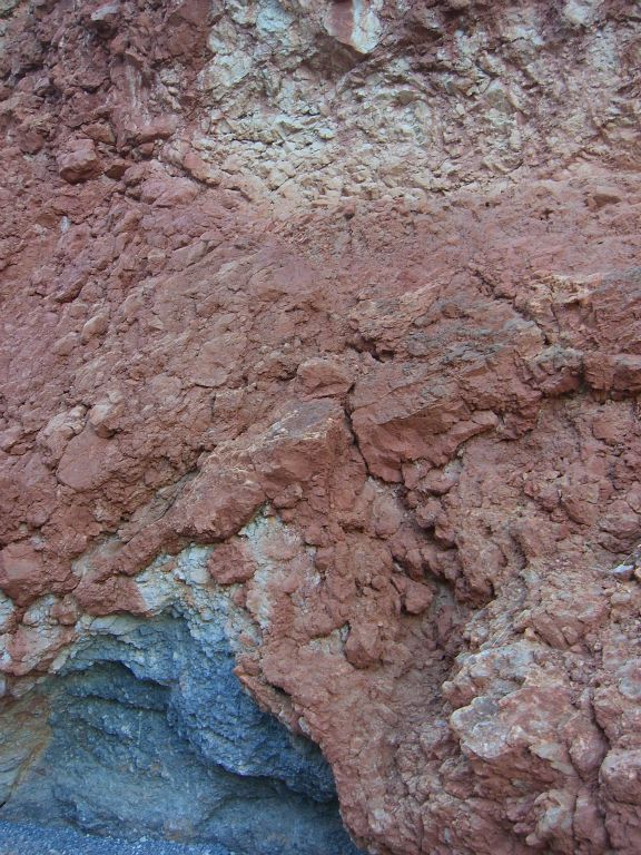 Taking a closer look at the reddish color of the canyon walls: